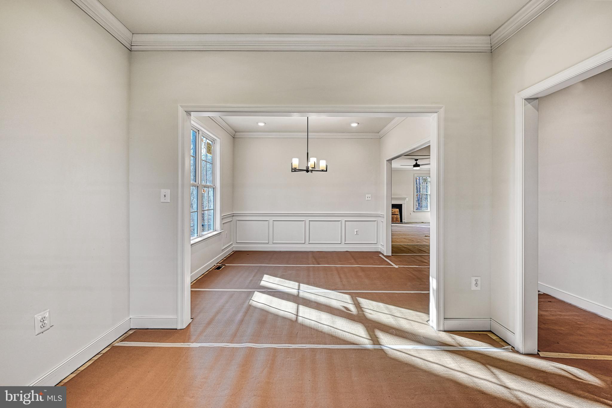 172 Covenant Way Bumpass, VA 23024 - Photo 15 of 56 a view of a room with wooden floor and white walls