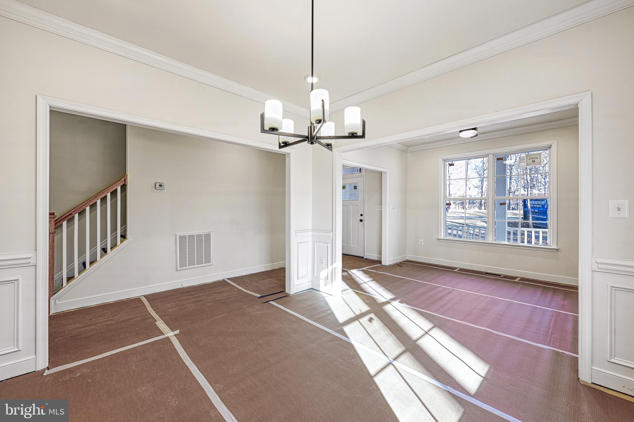 172 Covenant Way Bumpass, VA 23024 - Photo 17 of 56 a view of an empty room with a window and wooden floor