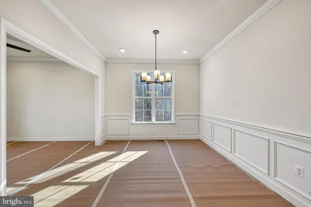 a large kitchen with stainless steel appliances granite countertop a sink and cabinets