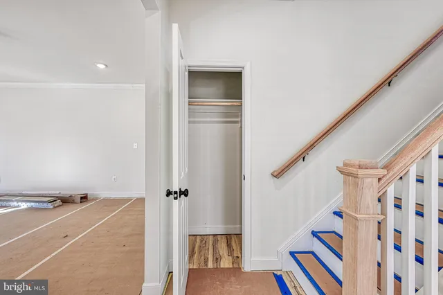 a spacious bathroom with a sink a faucet and a shower