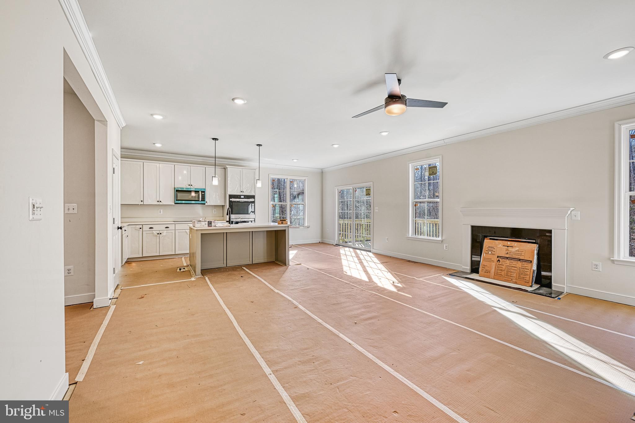 172 Covenant Way Bumpass, VA 23024 - Photo 21 of 56 a large kitchen with stainless steel appliances granite countertop a sink and cabinets