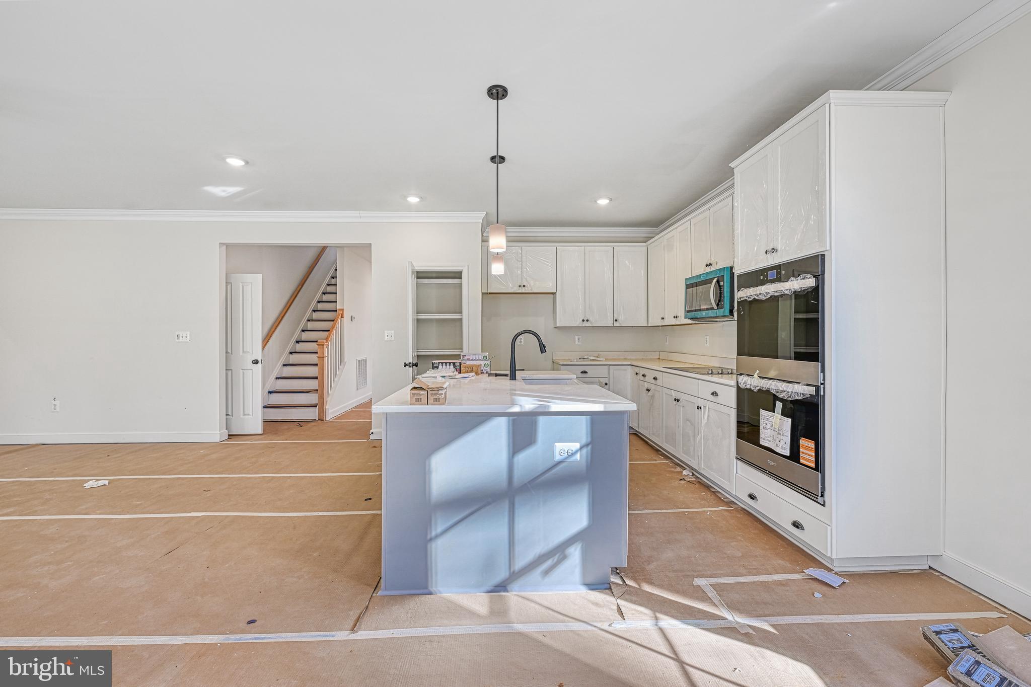 172 Covenant Way Bumpass, VA 23024 - Photo 23 of 56 a kitchen with stainless steel appliances granite countertop a sink a stove top oven a counter space and cabinets