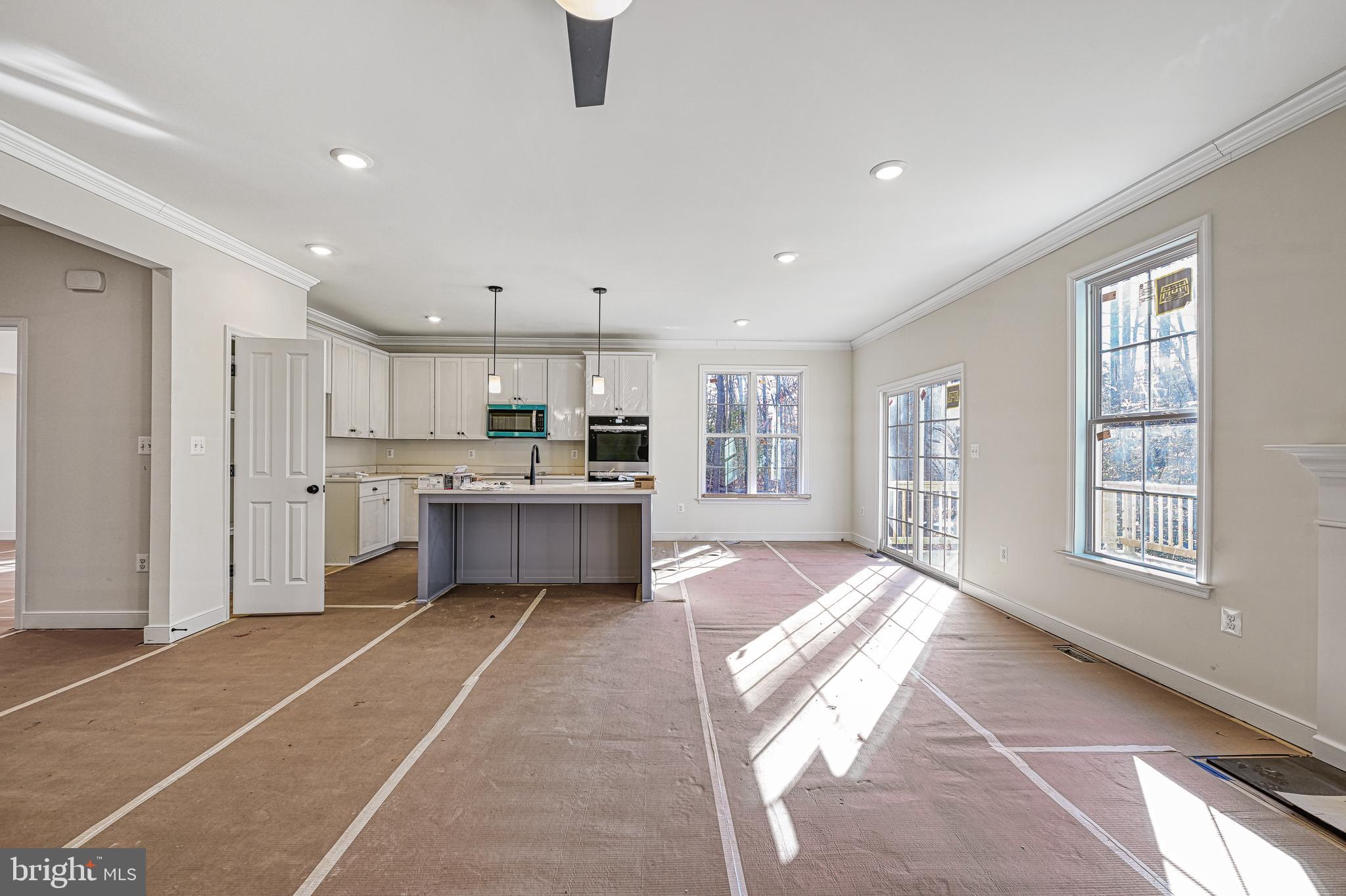 172 Covenant Way Bumpass, VA 23024 - Photo 25 of 56 a large kitchen with stainless steel appliances lots of counter space and windows