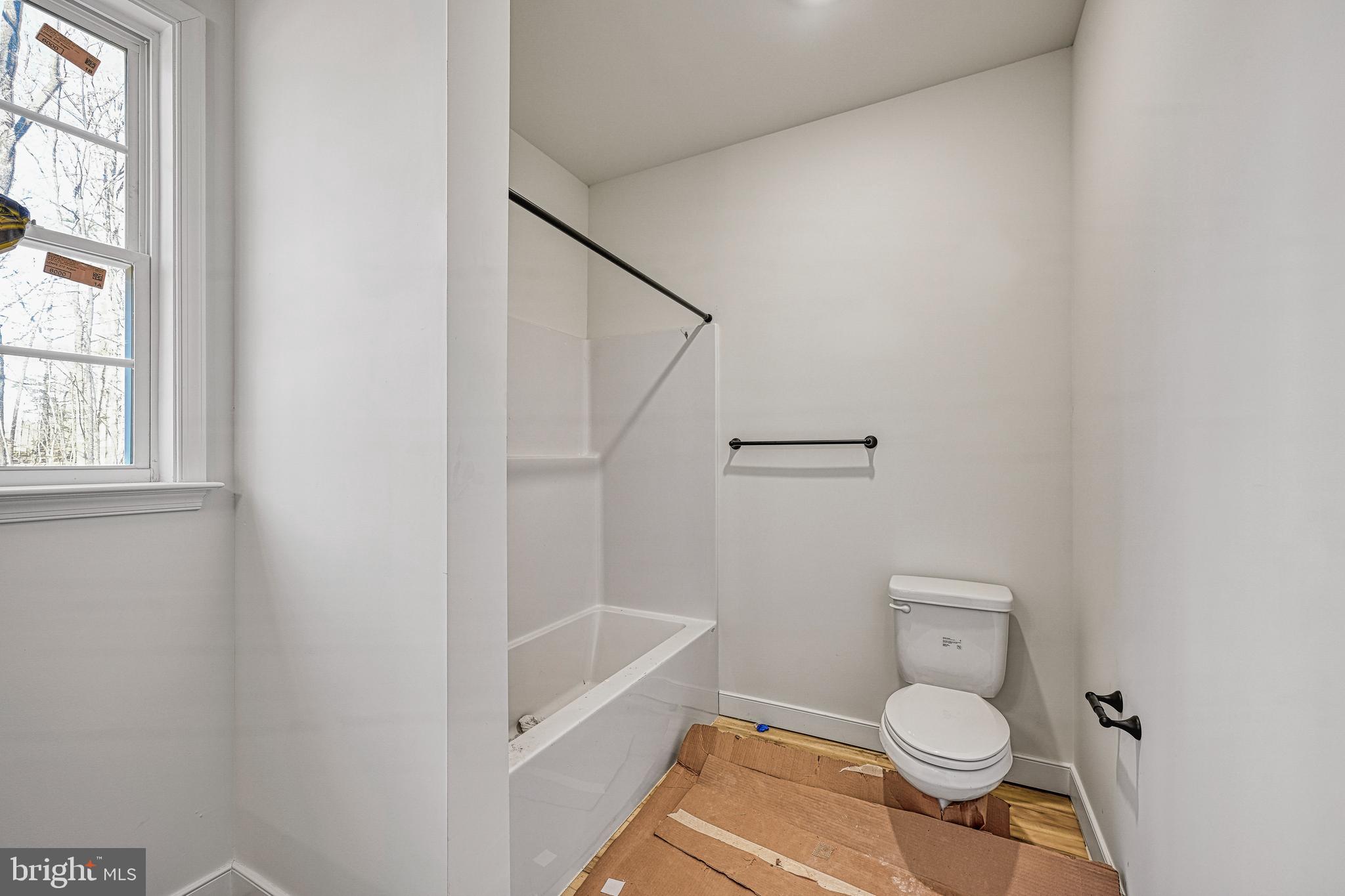 172 Covenant Way Bumpass, VA 23024 - Photo 27 of 56 a bathroom with a toilet and a shower