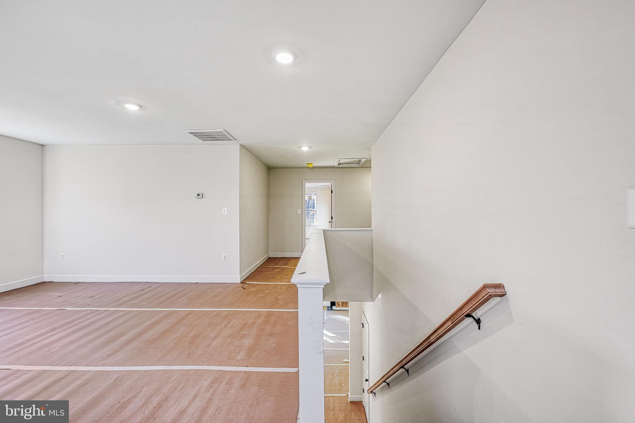 172 Covenant Way Bumpass, VA 23024 - Photo 35 of 56 a view of a room with wooden floor and staircase