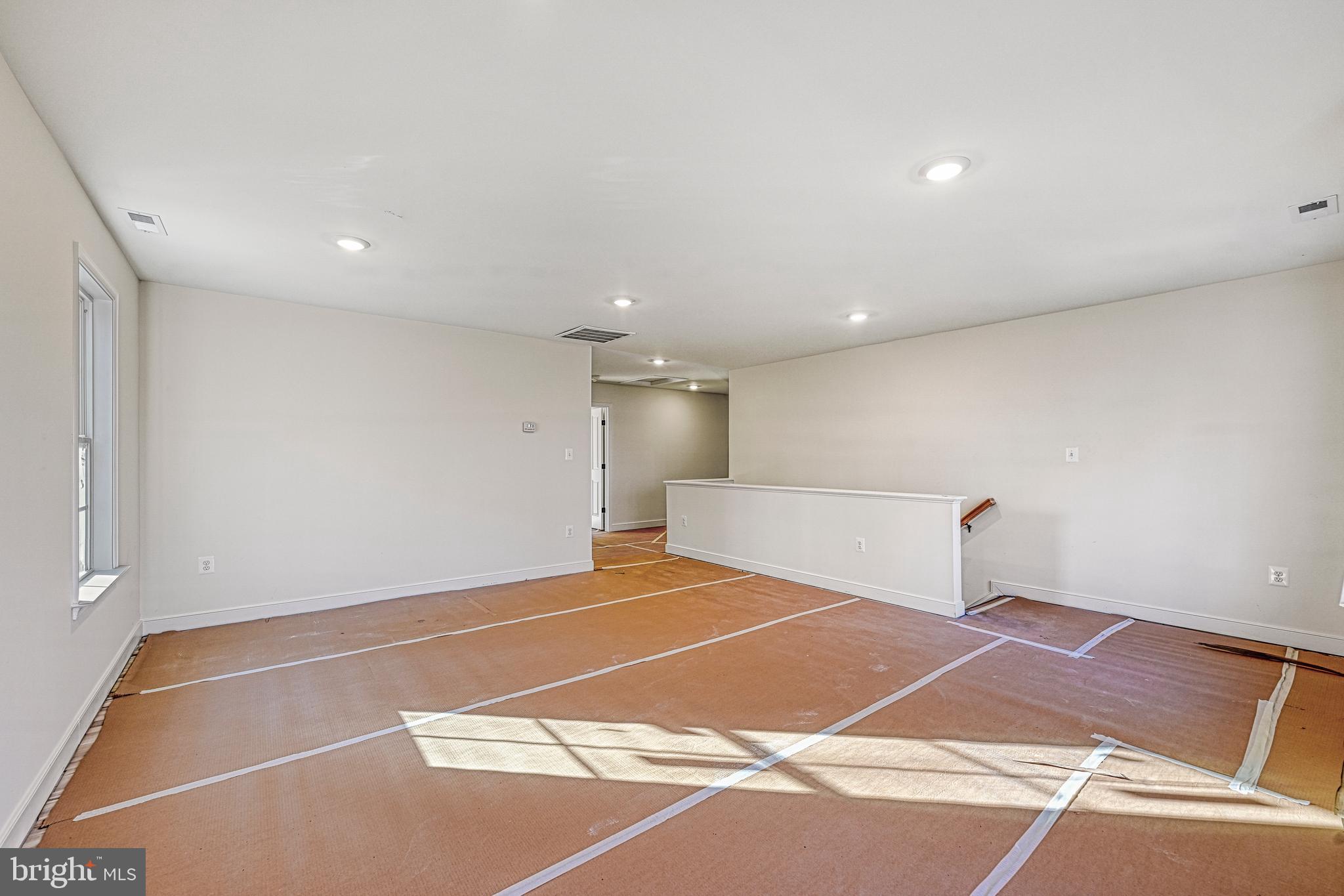172 Covenant Way Bumpass, VA 23024 - Photo 36 of 56 a room with a wooden floor and a table