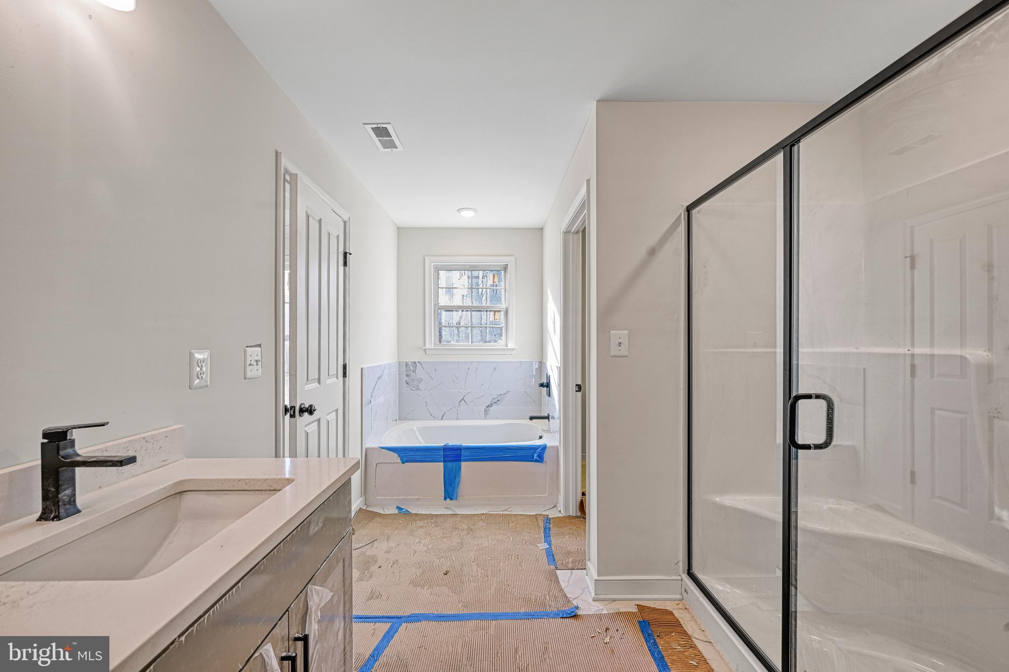 172 Covenant Way Bumpass, VA 23024 - Photo 42 of 56 a spacious bathroom with a tub and a sink