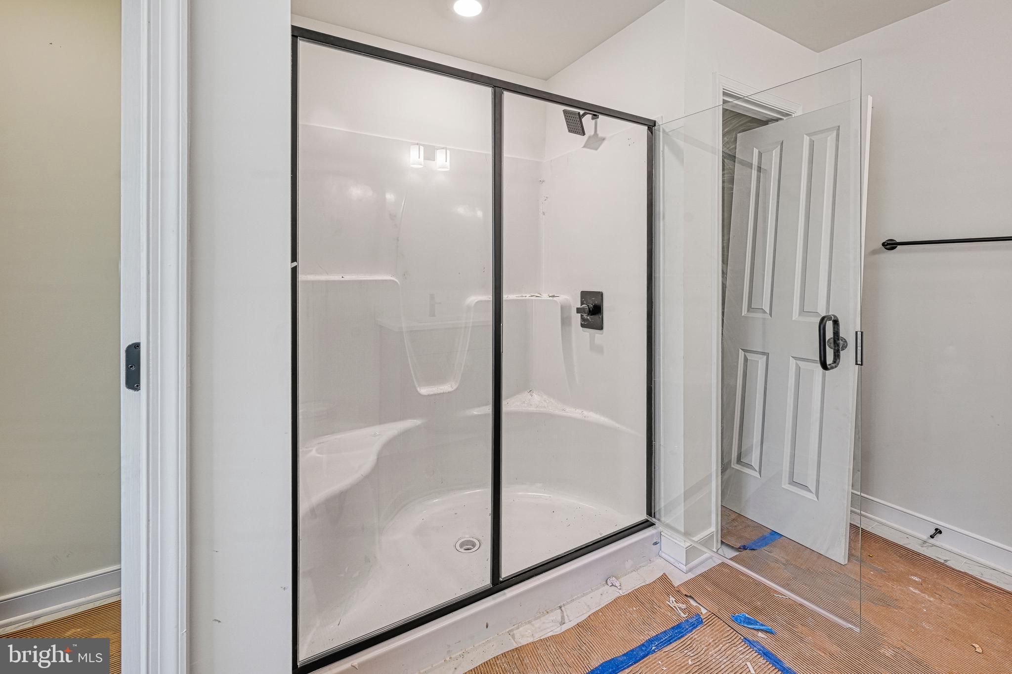 172 Covenant Way Bumpass, VA 23024 - Photo 43 of 56 a bathroom with a glass shower door