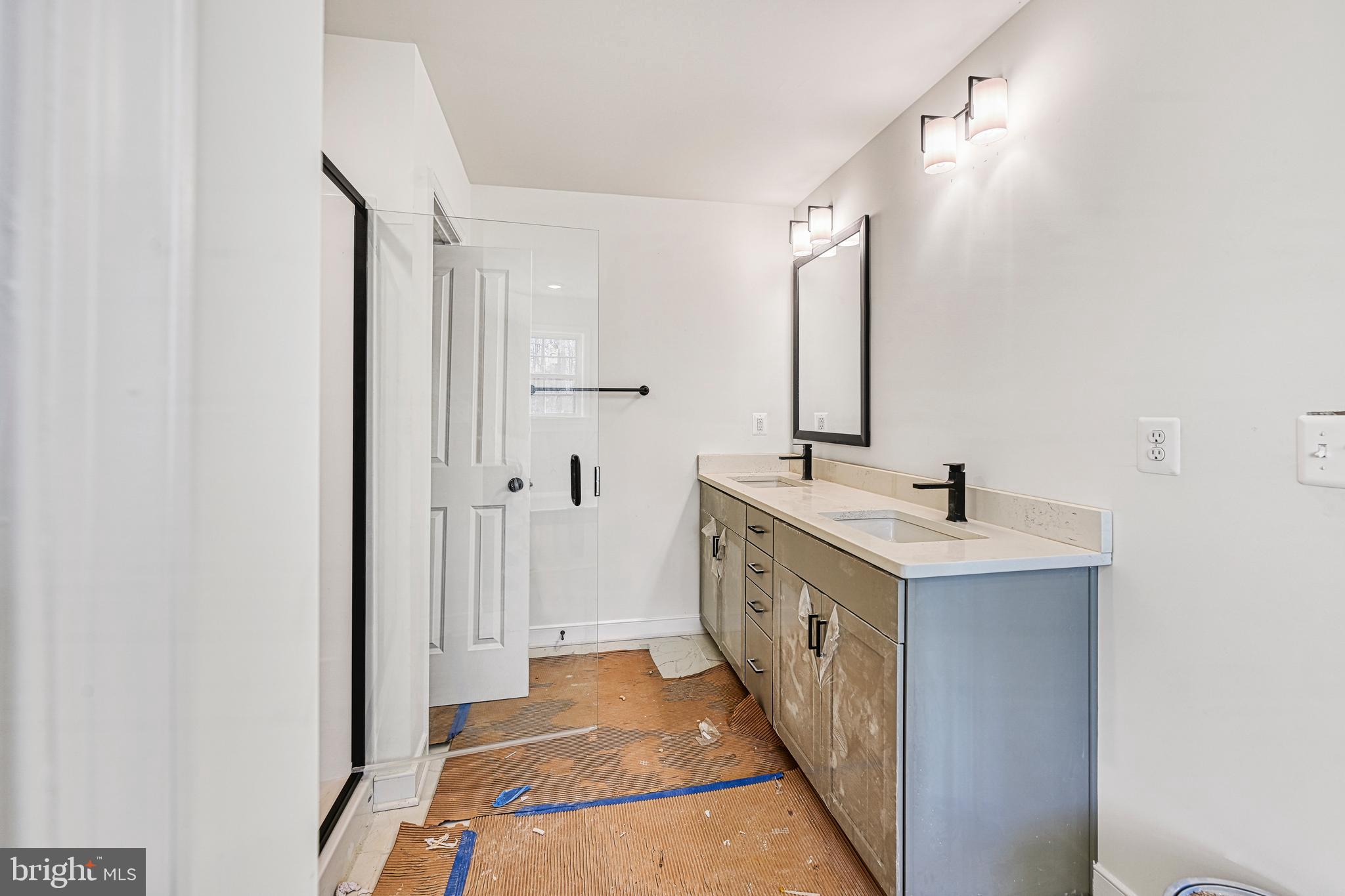 172 Covenant Way Bumpass, VA 23024 - Photo 44 of 56 a bathroom with a double vanity sink and mirror