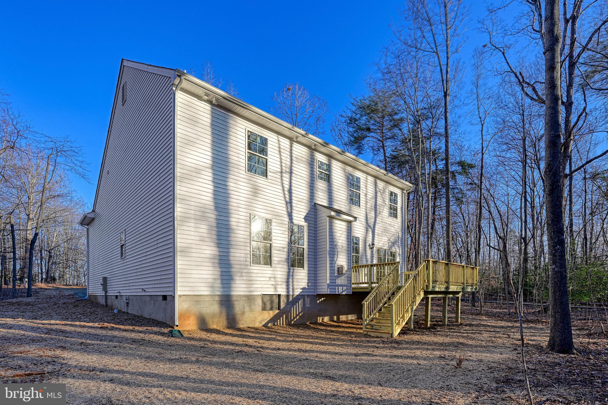 172 Covenant Way Bumpass, VA 23024 - Photo 5 of 56 a view of building with a flat tv screen and a bench