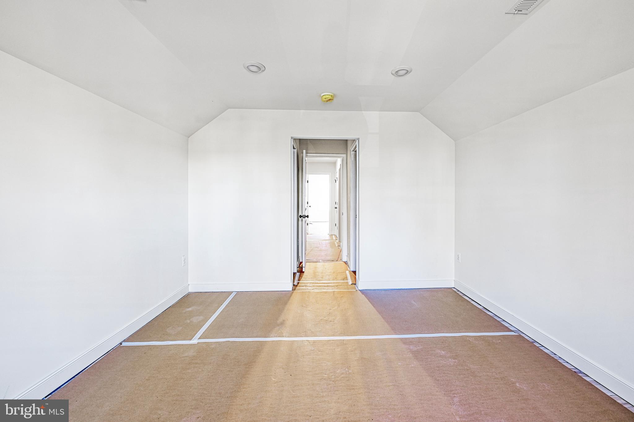 172 Covenant Way Bumpass, VA 23024 - Photo 54 of 56 a view of a room with wooden floor and white walls