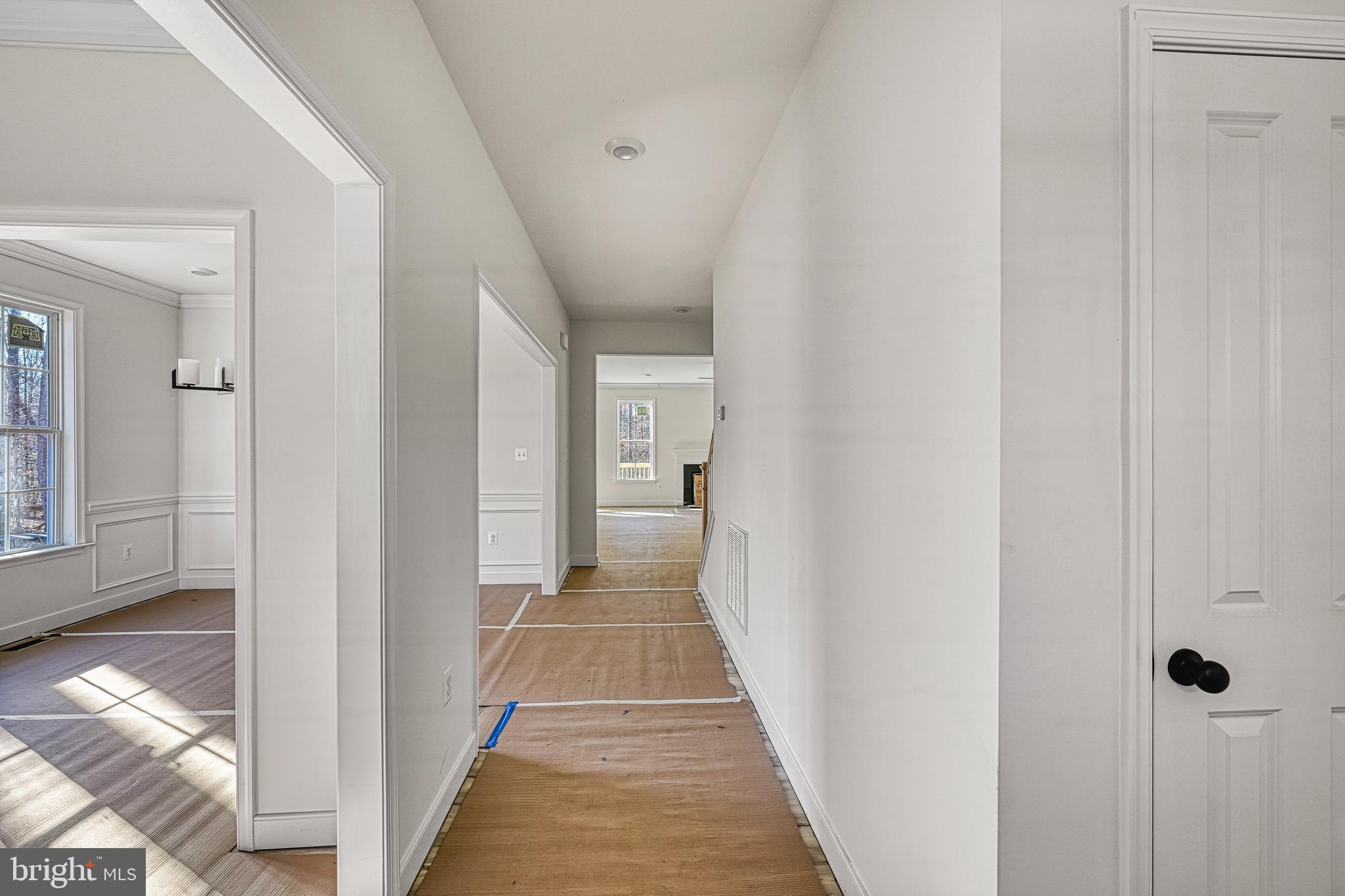 172 Covenant Way Bumpass, VA 23024 - Photo 10 of 56 a view of a hallway with wooden floor and a bathroom