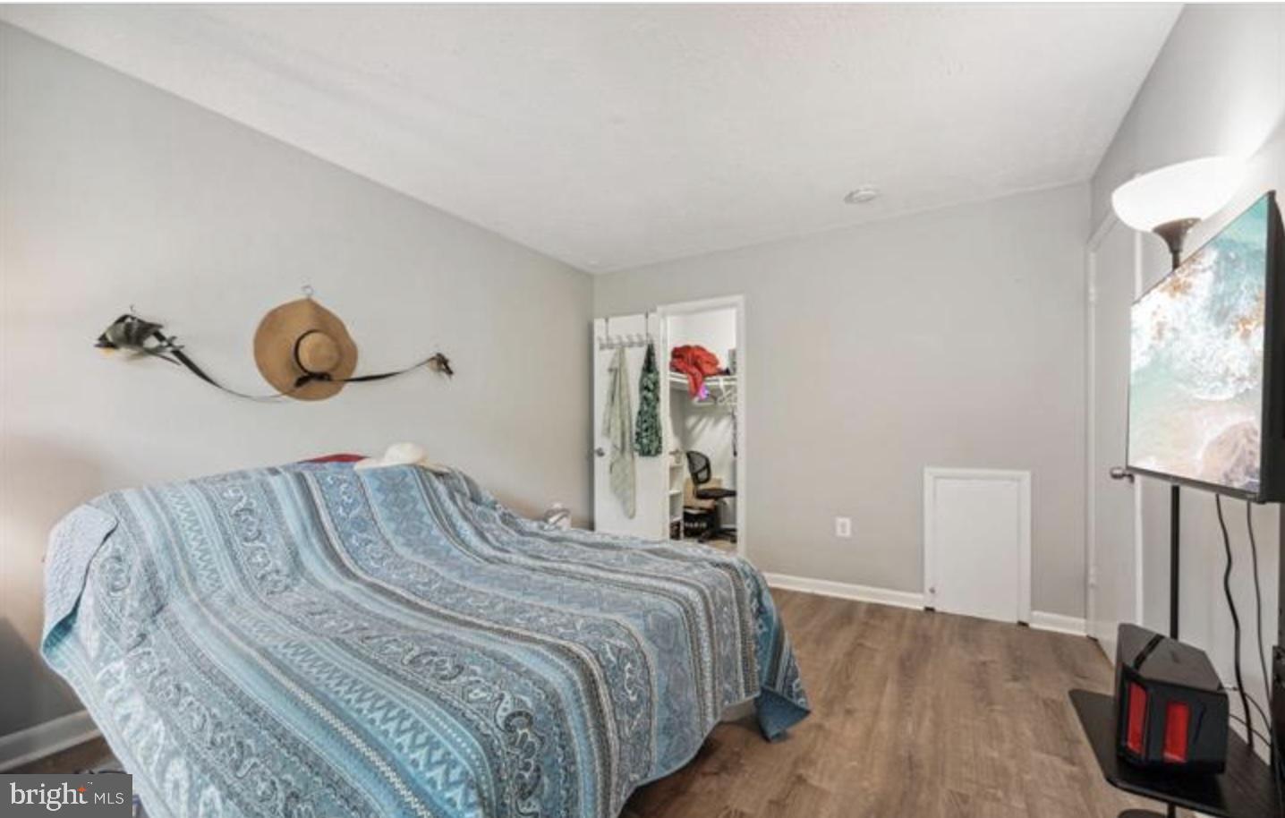 3841 St Barnabas Road, Unit T1 Suitland, MD 20746 - Photo 4 of 14 a bedroom with a bed and a large mirror