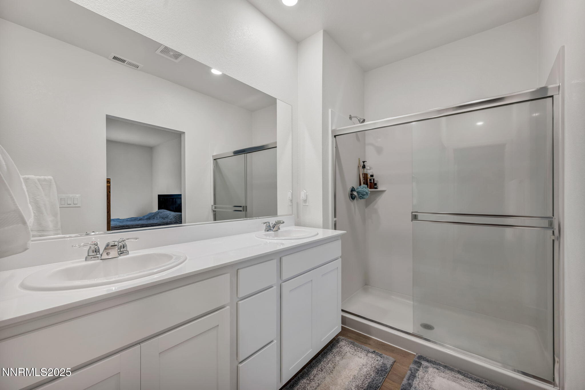 1019 Anthony Court Fernley, NV 89408 - Photo 13 of 55 a bathroom with a shower sink and mirror