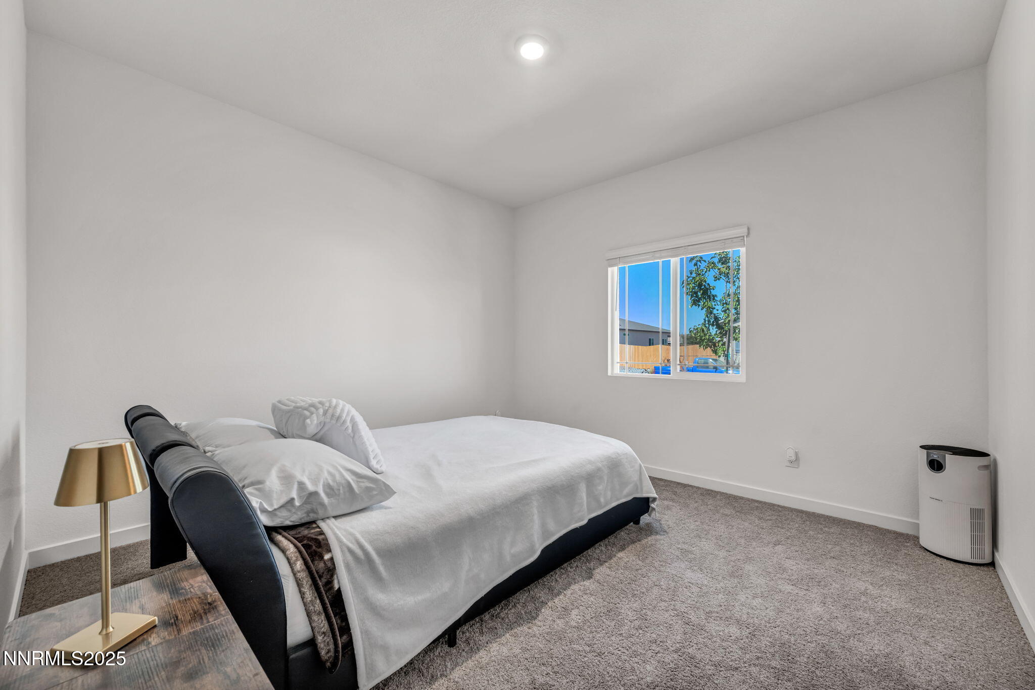 1019 Anthony Court Fernley, NV 89408 - Photo 14 of 55 a bedroom with a bed and a chair