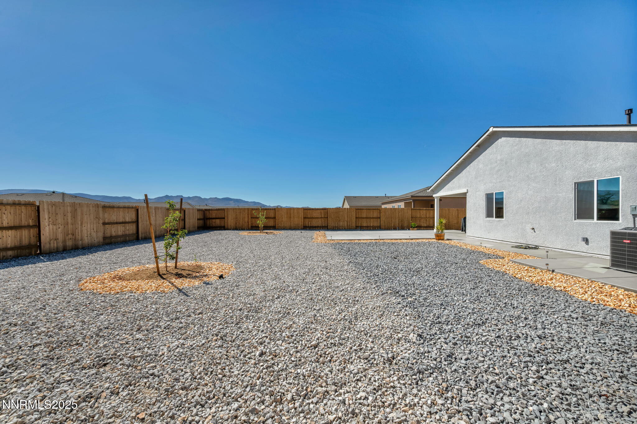 1019 Anthony Court Fernley, NV 89408 - Photo 19 of 55 a backyard of a house with a yard