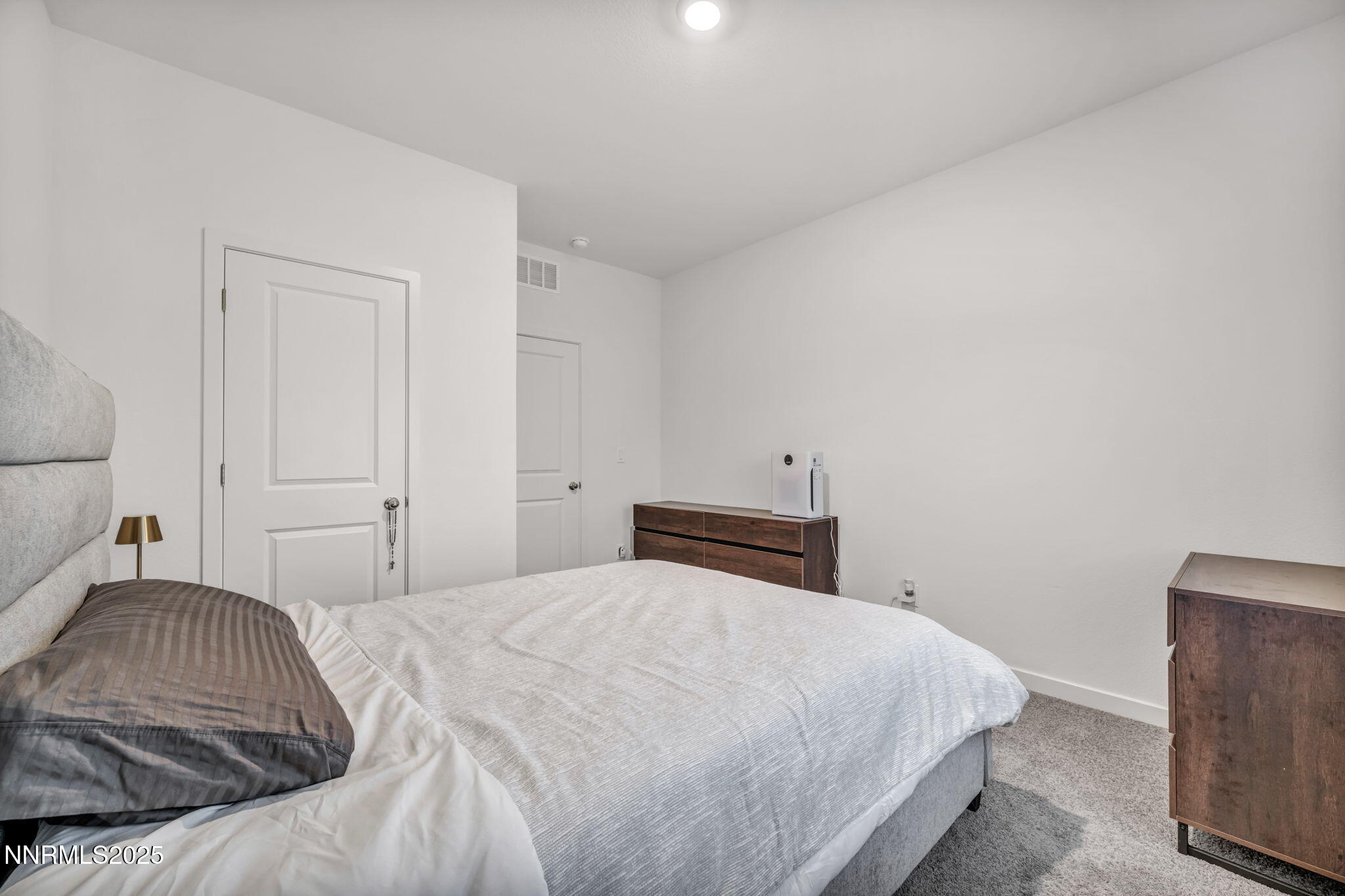 1019 Anthony Court Fernley, NV 89408 - Photo 26 of 55 a bedroom with a bed and a couch