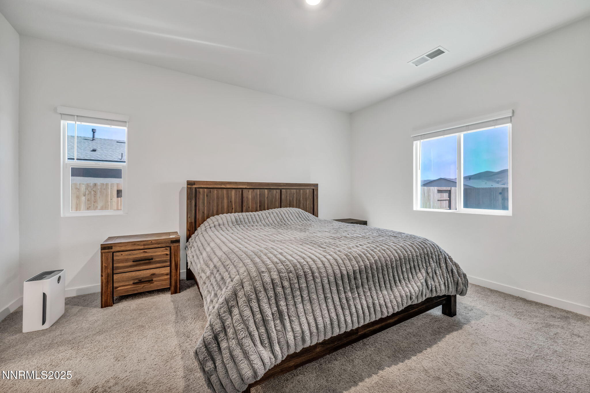 1019 Anthony Court Fernley, NV 89408 - Photo 28 of 55 a bedroom with a bed and a dresser