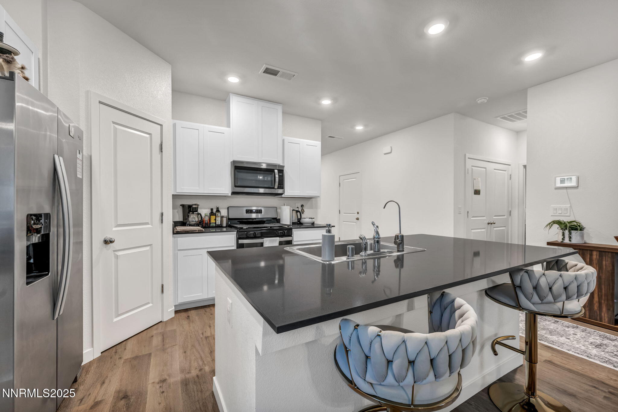 1019 Anthony Court Fernley, NV 89408 - Photo 3 of 55 a kitchen with granite countertop a sink a counter space stainless steel appliances and cabinets