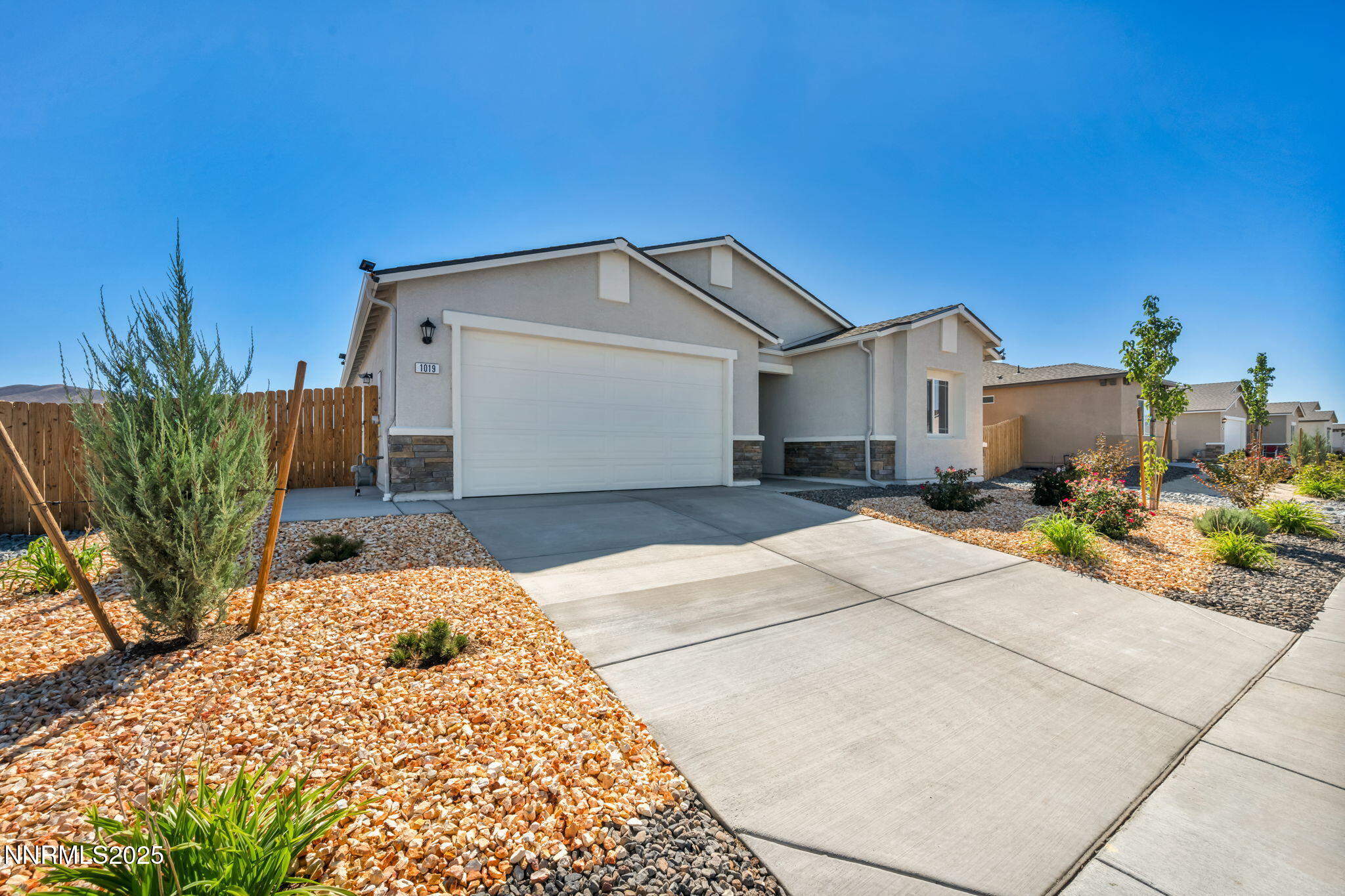 1019 Anthony Court Fernley, NV 89408 - Photo 31 of 55 a front view of a house with a yard