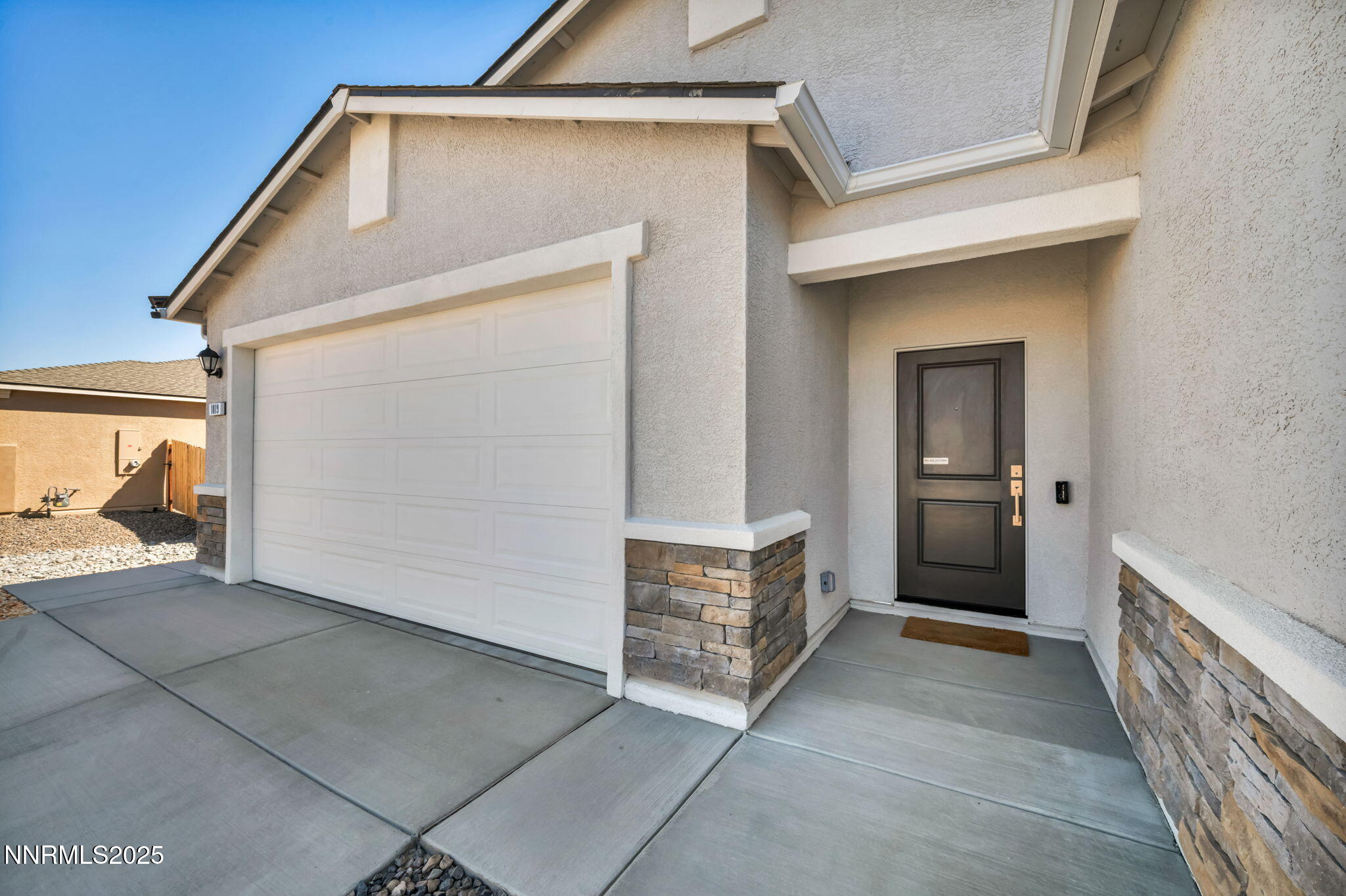 1019 Anthony Court Fernley, NV 89408 - Photo 32 of 55 a view of a hallway with a house