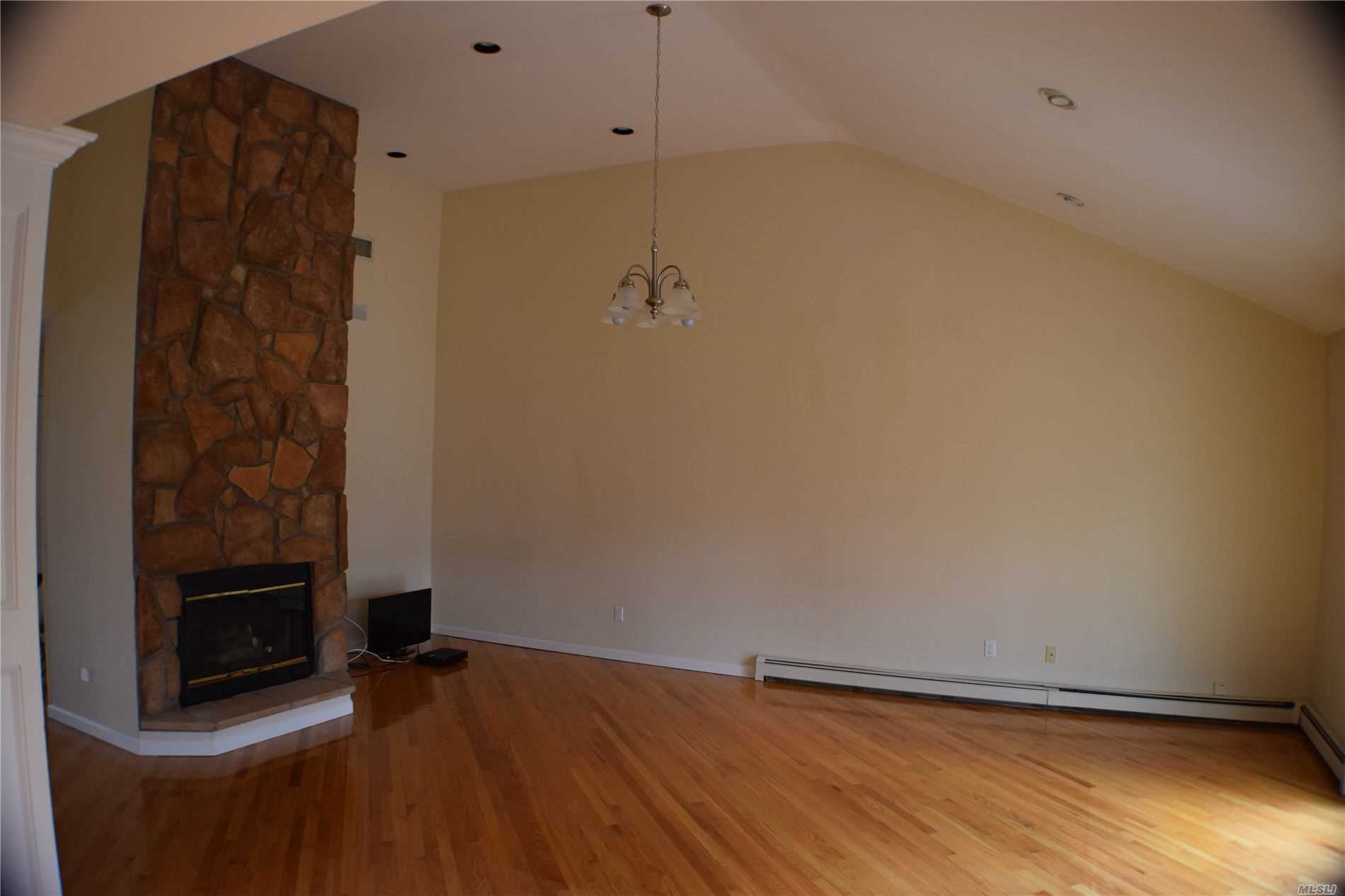 34 Jomar Road Shoreham, NY 11786 - Photo 9 of 20 den with fireplace