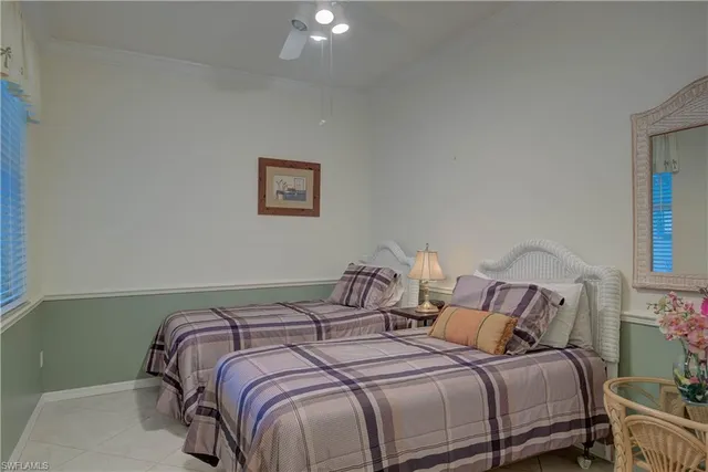 a bedroom with a bed and a lamp