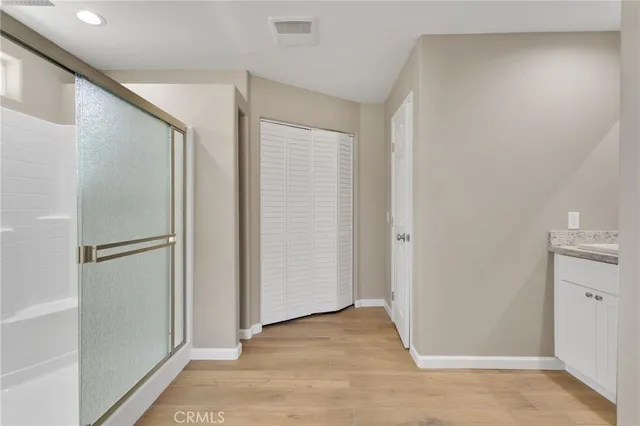 a bathroom with double sink and a mirror