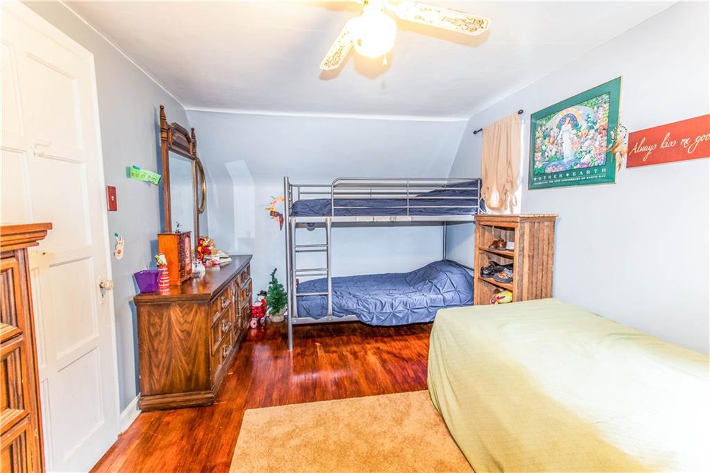 823 Agnew Road Baldwin, PA 15227 - Photo 14 of 21 The 3rd Bedroom is huge at 14x11 featuring Hardwood & a Ceiling Fan!
