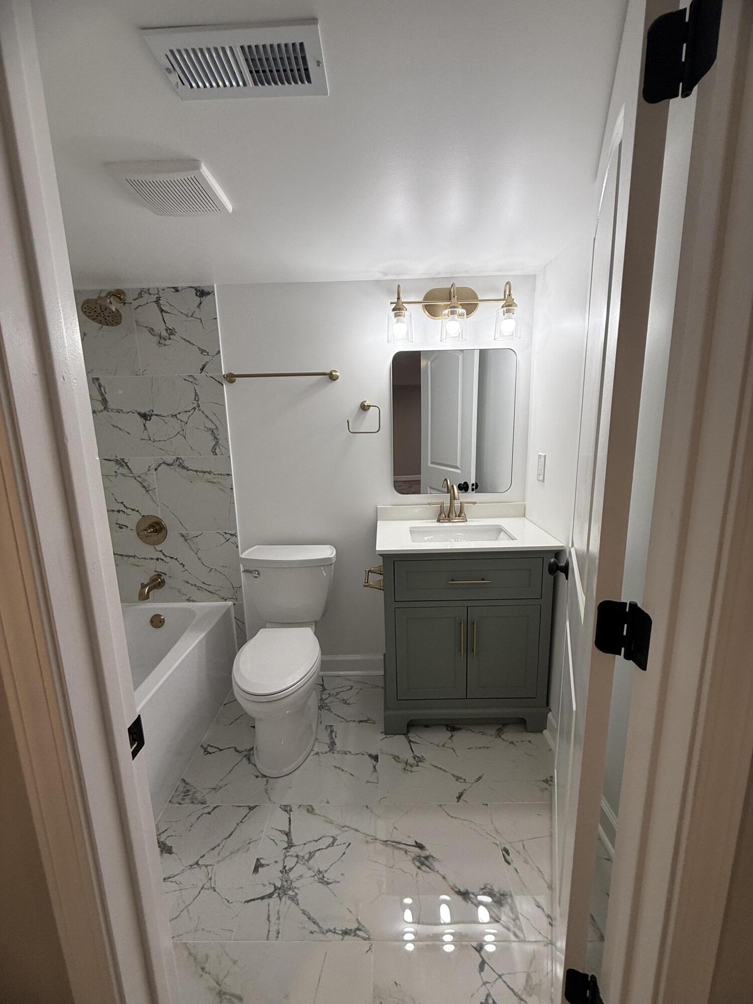 408 Cherry Hill Road Dyer, IN 46311 - Photo 24 of 31 a bathroom with a sink a toilet and shower