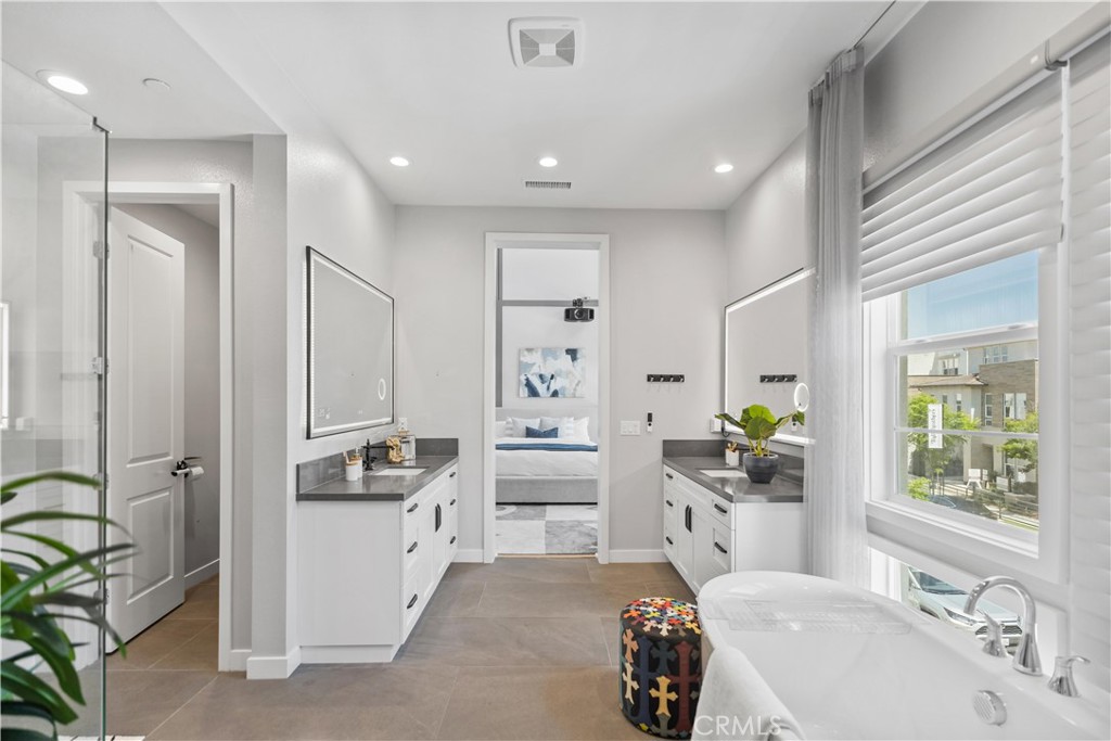 598 Alder Way Montebello, CA 90640 - Photo 25 of 56 a kitchen with white cabinets and appliances