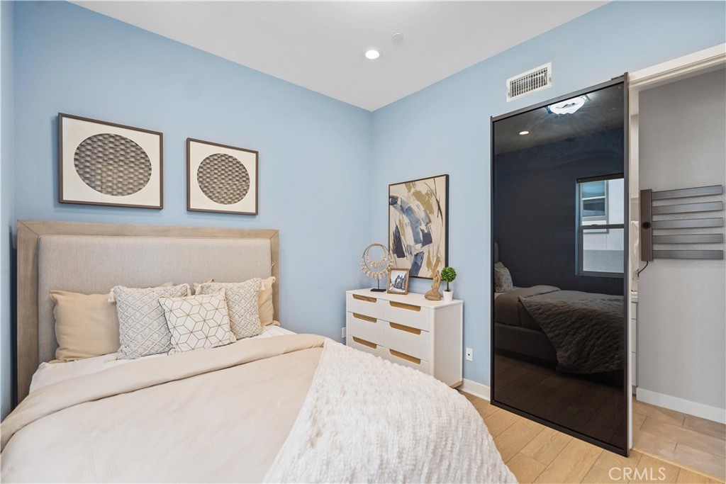 598 Alder Way Montebello, CA 90640 - Photo 30 of 56 a bedroom with a bed and cabinets