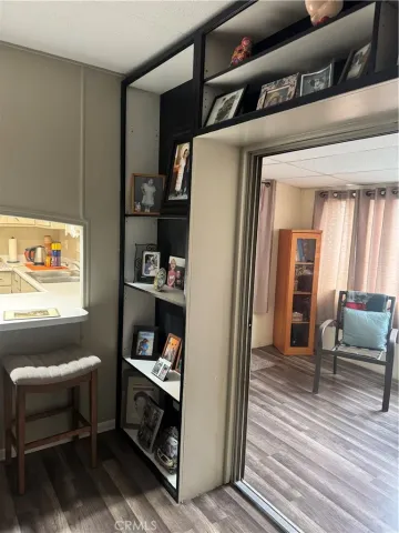 a bedroom with furniture and wooden floor