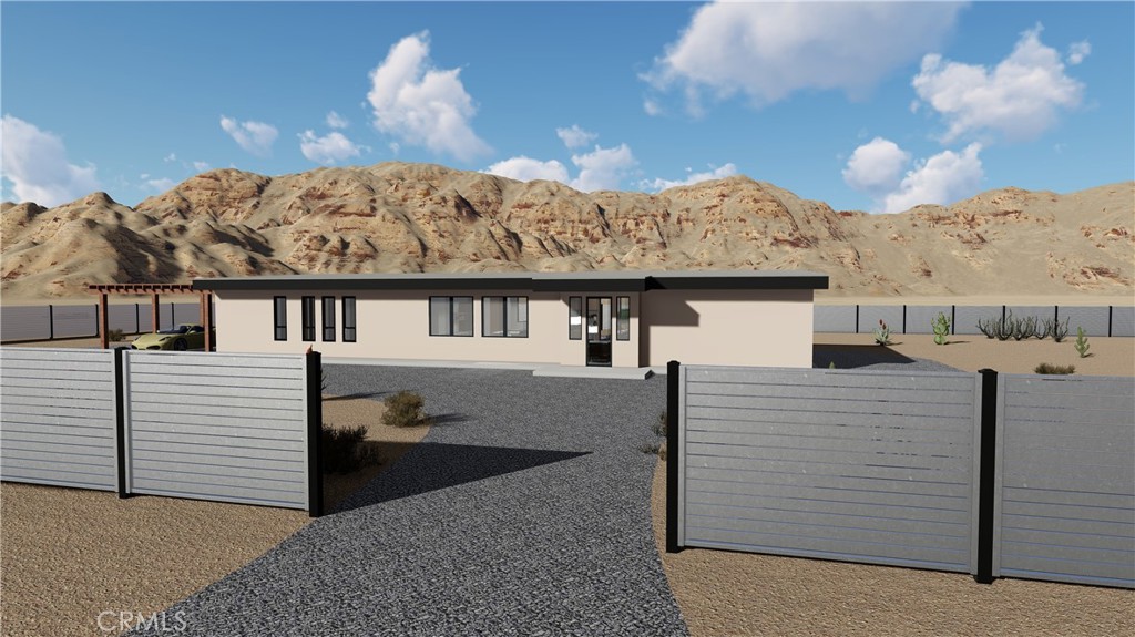 64845 Sun Oro Road Joshua Tree, CA 92252 - Photo 11 of 52 a view of a house with a balcony