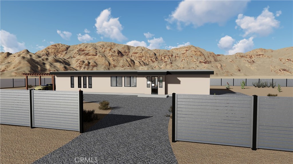 64845 Sun Oro Road Joshua Tree, CA 92252 - Photo 12 of 52 a view of a house with a balcony