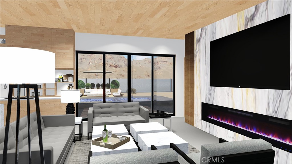 64845 Sun Oro Road Joshua Tree, CA 92252 - Photo 22 of 52 a living room with a flat screen tv and a floor to ceiling window