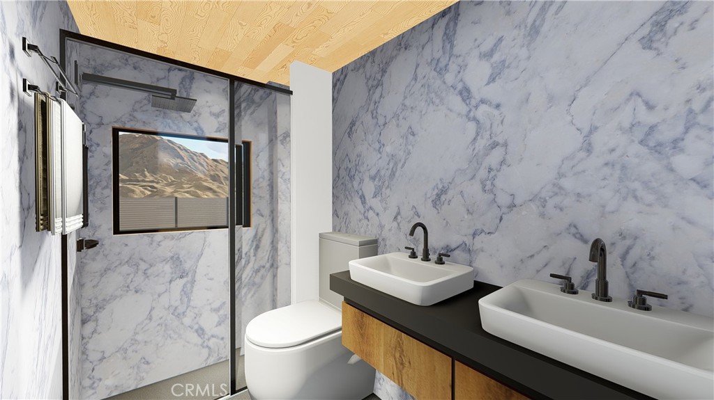 64845 Sun Oro Road Joshua Tree, CA 92252 - Photo 26 of 52 a bathroom with a toilet sink and mirror