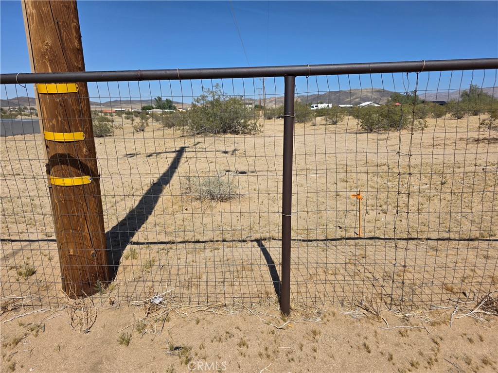 64845 Sun Oro Road Joshua Tree, CA 92252 - Photo 32 of 52 a view of entryway with a door and wooden floor