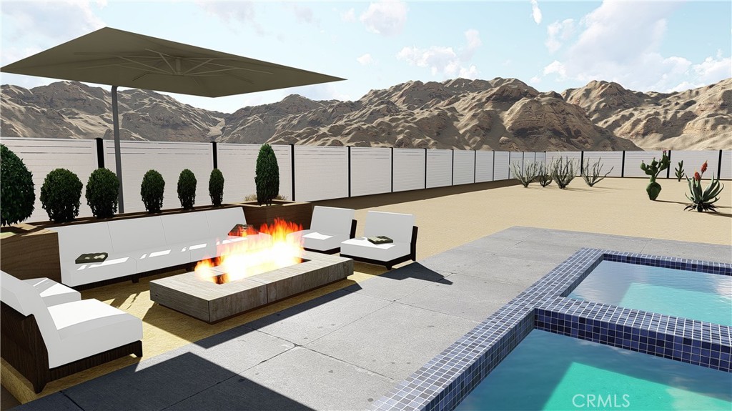 64845 Sun Oro Road Joshua Tree, CA 92252 - Photo 7 of 52 a swimming pool with mountain view and sitting space
