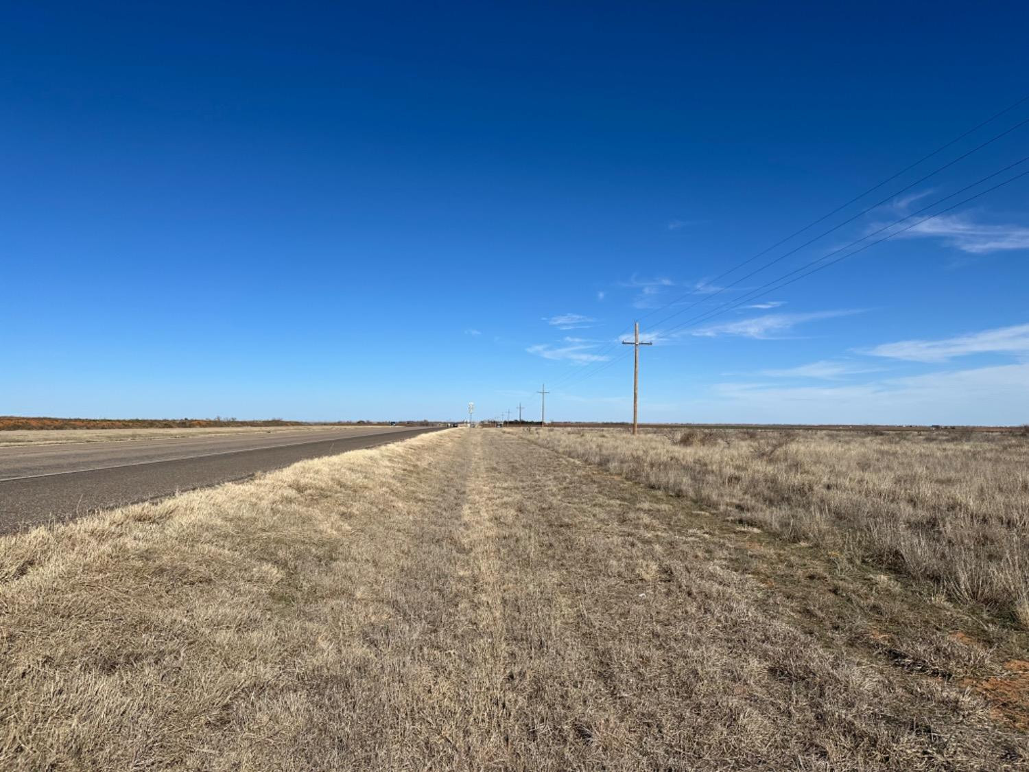 4045 Highway 62 Ropesville, TX 79358 - Photo 4 of 7 a view of empty room with wooden floor
