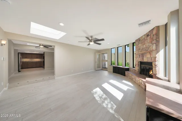 a view of livingroom with furniture and a fireplace