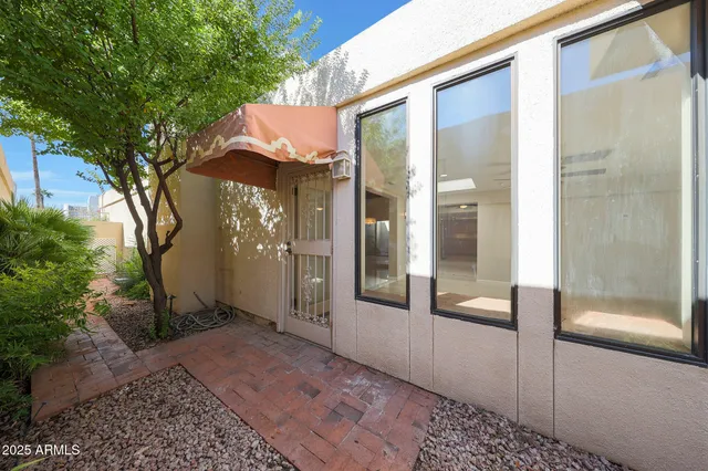 a view of a glass door with a yard