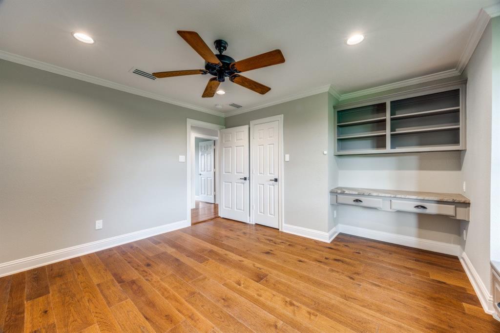 3244 Joe Davis Road Whitewright, TX 75491 - Photo 19 of 28 Unfurnished bedroom featuring built in desk, light wood finished floors, recessed lighting, crown molding, and ceiling fan