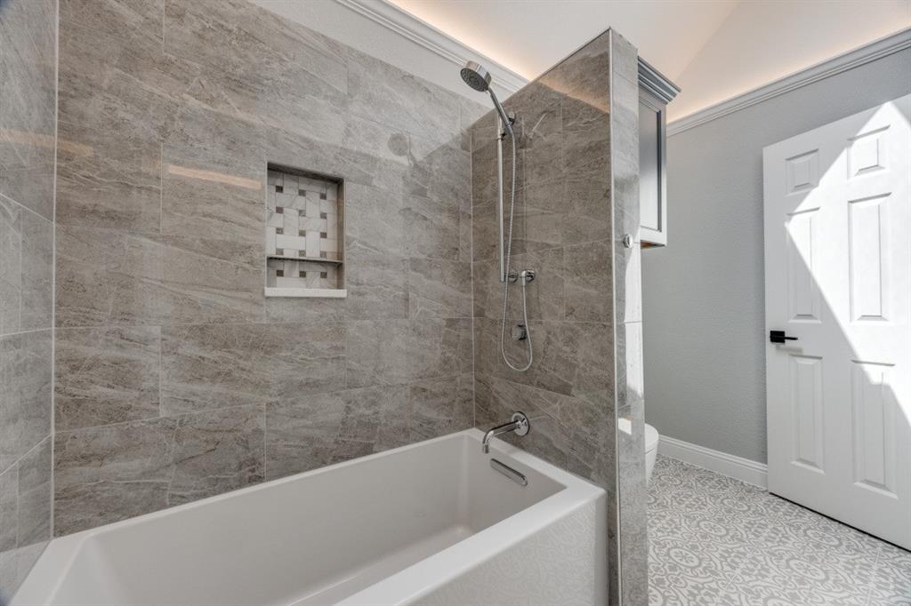 3244 Joe Davis Road Whitewright, TX 75491 - Photo 20 of 28 Full bath with washtub / shower combination and tile patterned floors