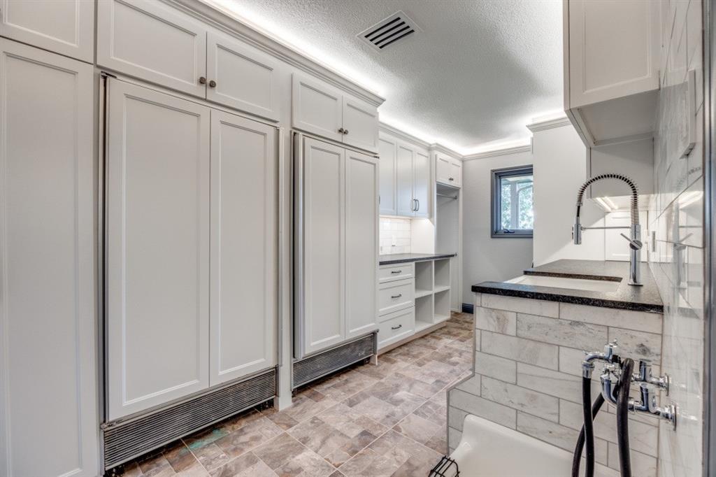3244 Joe Davis Road Whitewright, TX 75491 - Photo 21 of 28 Kitchen with a textured ceiling, white cabinetry, and dark countertops