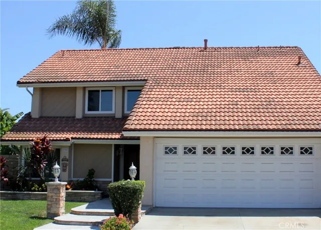a front view of a house with a garage