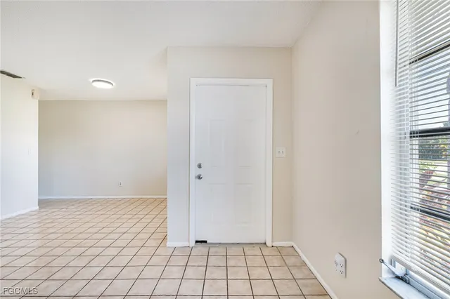 a view of an empty room and window