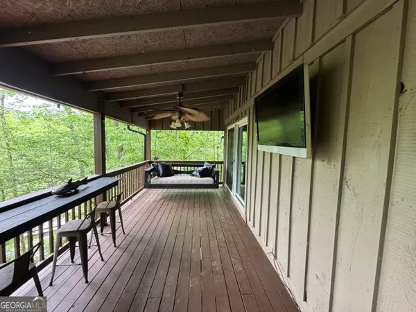 a view of balcony with wooden floor
