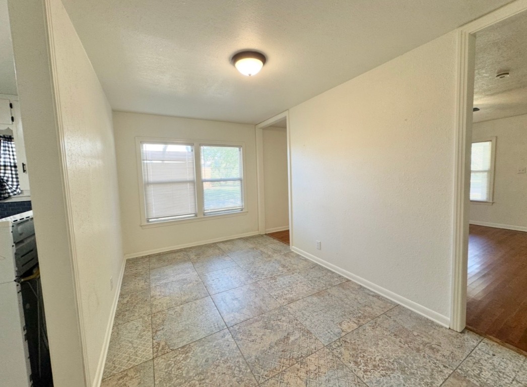 110 East 8th Street Elgin, TX 78621 - Photo 7 of 17 an empty room with windows and entrance