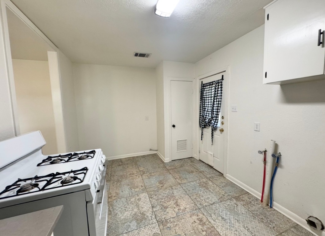 110 East 8th Street Elgin, TX 78621 - Photo 9 of 17 a view of a livingroom with a stove